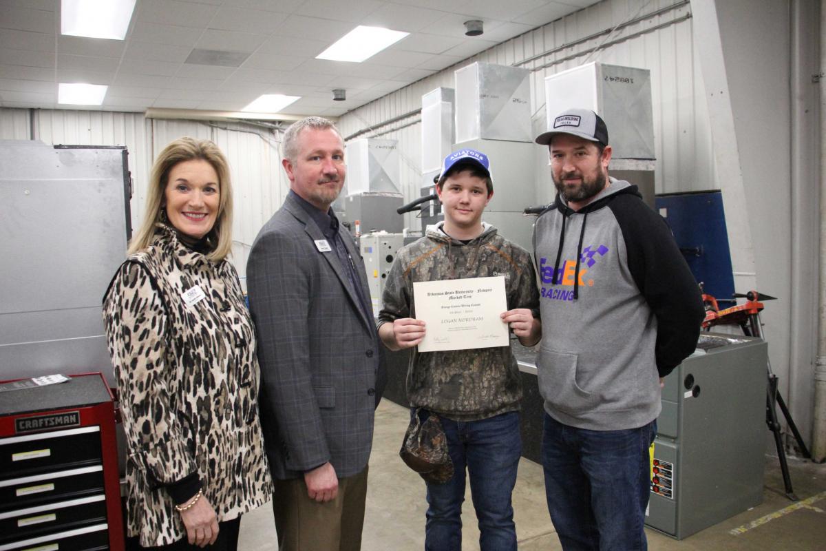 Pictured from left to right: Dr. Sandra Massey, Chancellor, Robert Burgess, Dean of Applied Science, Logan Nordrum (Third Place), and Caliem Morris, Valley View High School Instructor.