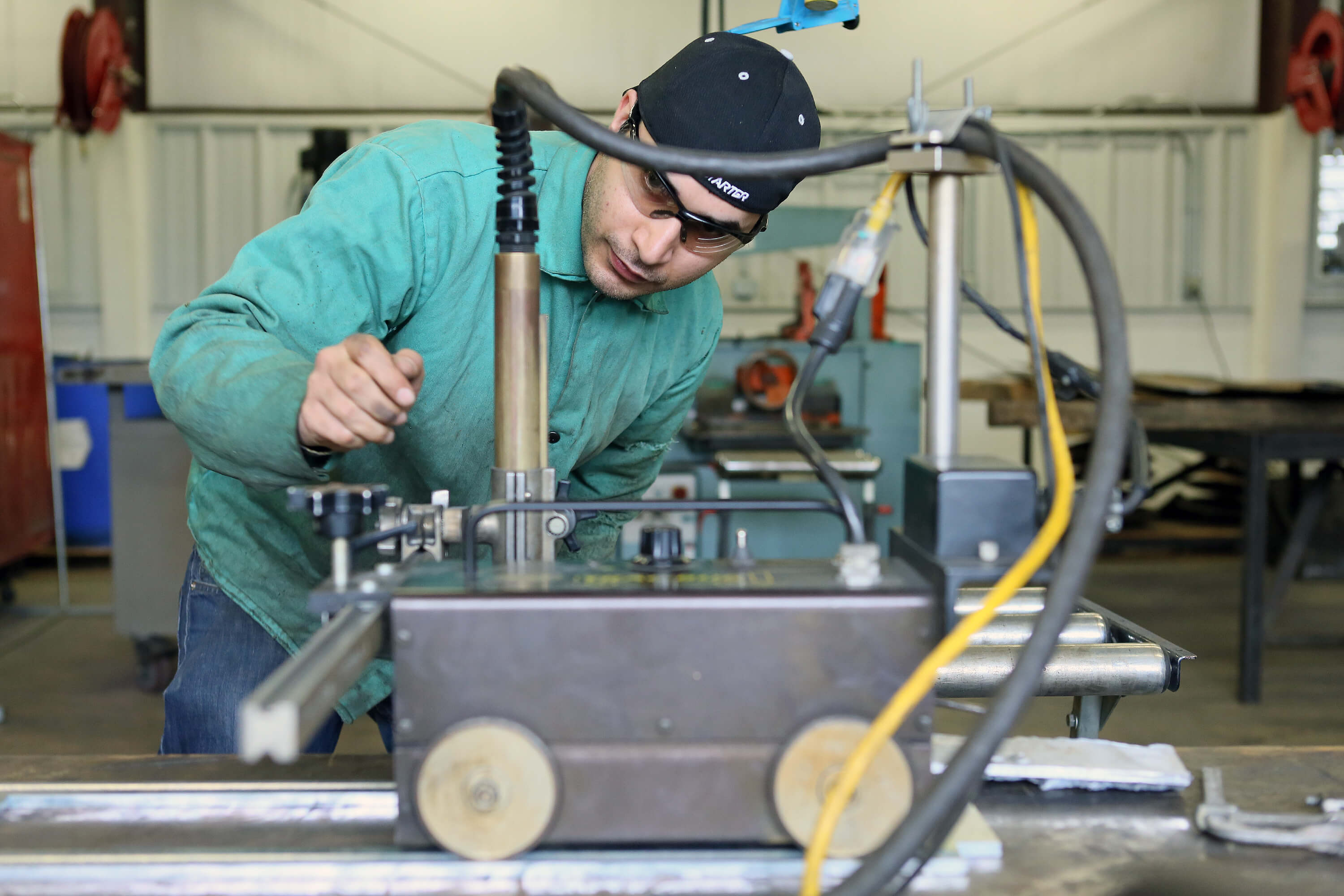 welding student operating a machine