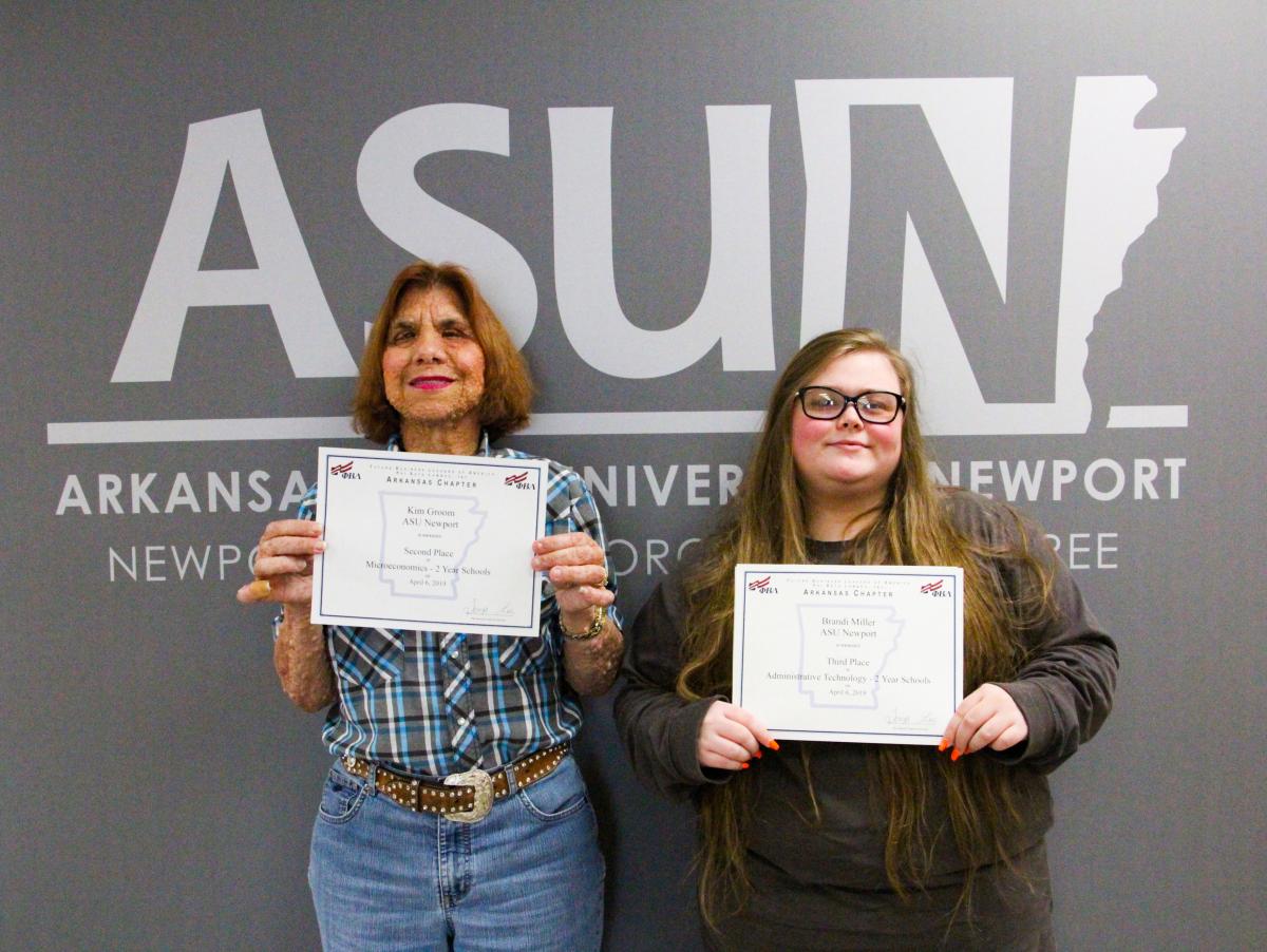 Pictured from left: Kim Groom of Jonesboro received second place for Microeconomics, Brandi Miller of Marked Tree received third place for Administrative Technology.