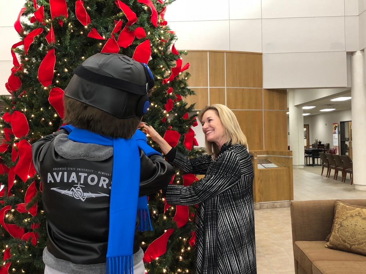 Dr. Massey pictured with Ace the Aviator, Christmas 2018