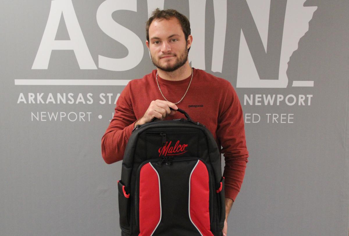 Lukas Hicks pictured with Malco products