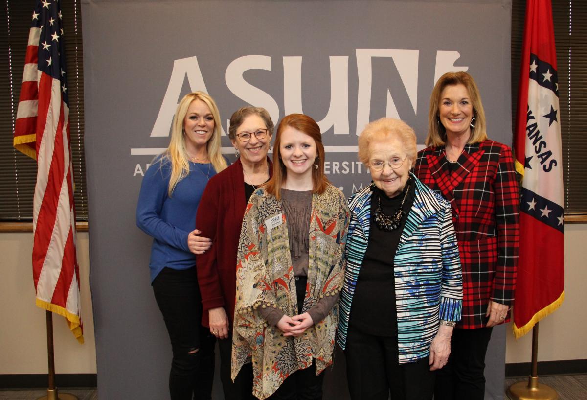 Dr. Massey pictured with her family and scholarship winner
