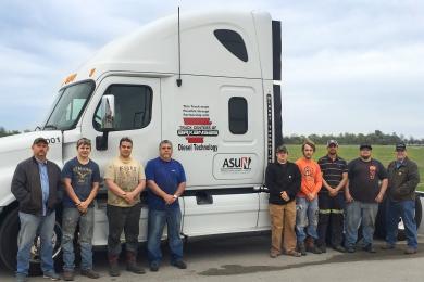 Diesel Technology Students standing by Truck Services Truck