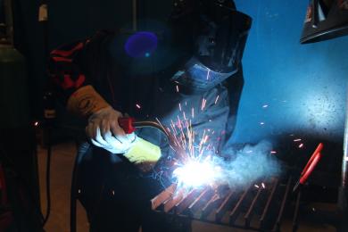 Person Welding...sparks flying.
